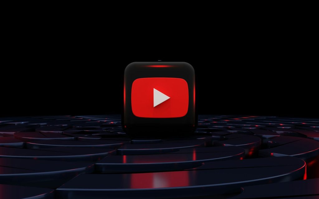 a red play button on a black background